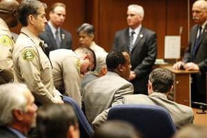07nov011_murray_handcuffed_01.jpg